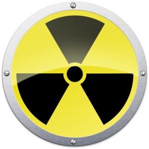 An image of a radioactive button with a metal edge.