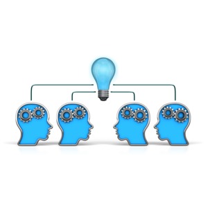 This clip art shows four heads working together to find an idea.