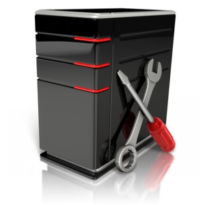 An image of a computer with tools leaning against the case.