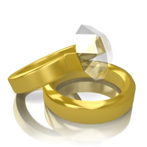 Conjoined gold wedding rings rest on one another.