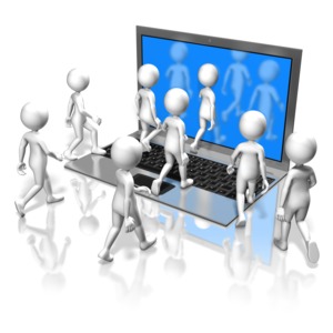 A group of stick figures approach and walk into the screen of a notebook computer. This clip-art can represent a group of people meeting virtually.