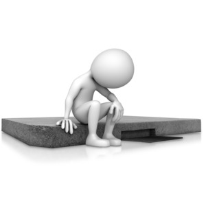 A depressed figure sits on a curb.