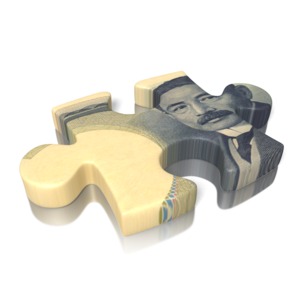 A puzzle piece with the yen on the face of the piece.
