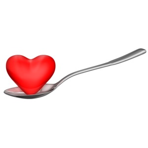 This clip art image shows a heart shape sitting in a spoon.  Displays a concept of eating healthy.