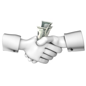 Two hand shaking in a deal involving a money exchange.