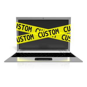 An image of a laptop wrapped with tape to put custom text on
