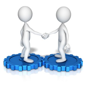 Two figure shake hands while standing on their own gears which interconnect with each other.