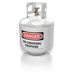 A propane cylinder with a warning label.