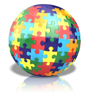 An image of a globe with multi-colored puzzle pieces forming the sphere.