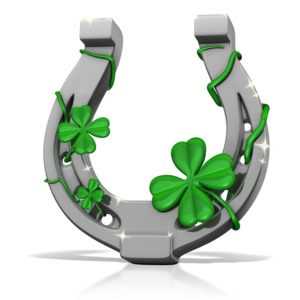 This clip art image shows a lucky horseshoe with four leaf lovers growing on it.