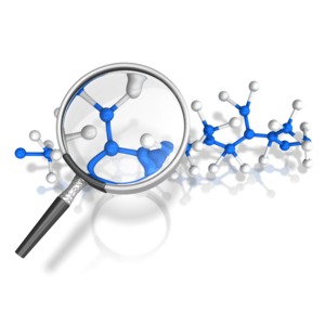 This clip art shows a magnifying glass looking at a molecular chain.
