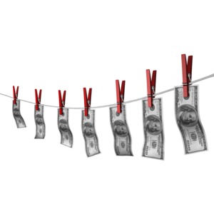This clip art image shows money clip to a clothesline illustrating a concept of money laundering.