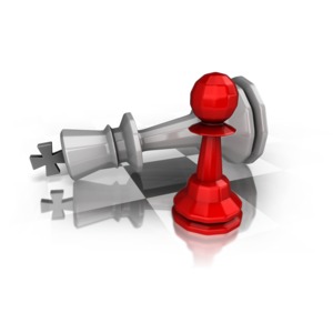 A pawn is shown sitting on a board with a toppled king. 