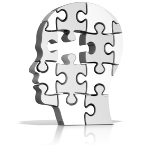 This clip art image shows a head puzzle with a piece missing.