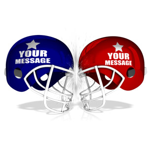Two football helmets are shown about to collide into each other. There is room to add you own custom design or text on each of the helmets.
