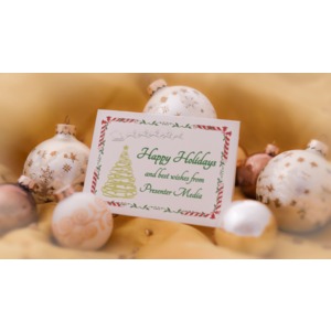 Customize a holiday card sitting among several ornate Christmas tree bulbs.
