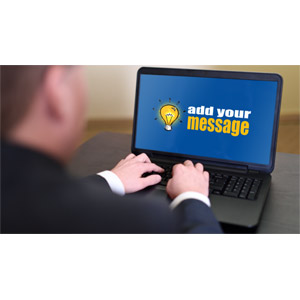 A business person types on a notebook computer with your custom design on the screen.