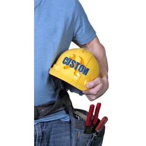 A construction guy holds a yellow hard hat with you custom design on it.