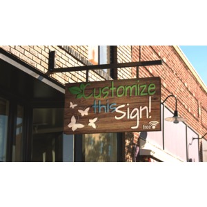 This custom design photograph shows a wood sign hanging out in front of a store.
