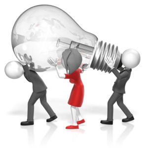 A team of business people carry a giant light bulb.