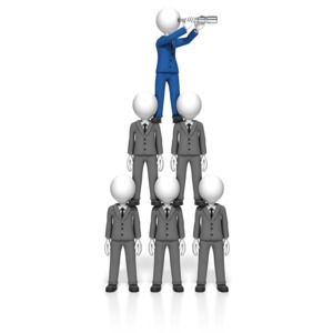 A group of business form a pyramid so the man on top can use a spyglass to see ahead.