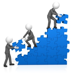 Three businessmen work together to complete a staircase of puzzle pieces.