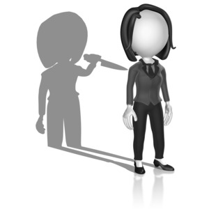 A business woman stick figure stands as her shadow brandishes a knife.