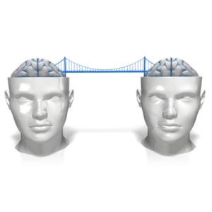 This clip art image shows two heads with brains and a bridge spanning a connection between them.