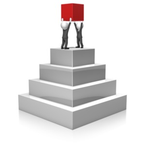 A pair of businessmen hold up the last block of a pyramid. This clip-art can represent building business and profit.