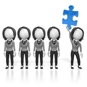 One business woman among many holds the missing piece of the puzzle.