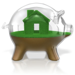 A grass house and lawn on dirt sits inside a glass piggy bank. This clip-art can represent saving for a home.