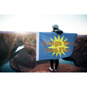 A woman stands outside holding a customizable flag across her back.