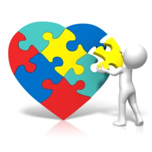 An image of a autism inspired heart with a figure putting a piece of the puzzle together.