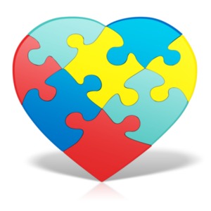 An image of a puzzle with colors representing Autism in the shape of a heart.