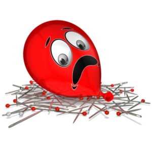 This clip art image shows a balloon with a frightened face sitting on a bed of pins and needles.  This displays the idiom, on pins and needles.
