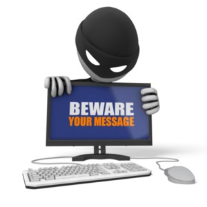 A thief peers over a computer monitor in this concept of cyber crime. You can change the message on the monitor using our on-line tools.