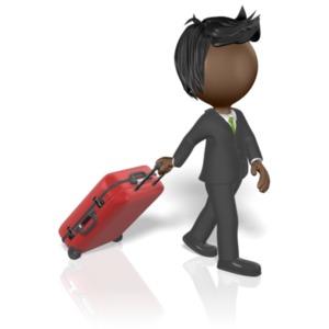 A businessman pulls some luggage behind him.