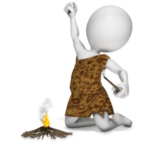 This clipart image shows a caveman holding a stick use to start a fire.