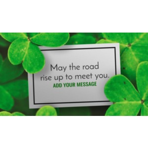 A close up of a card in a field of clover. You may add your own message to the card using our on-line tools.