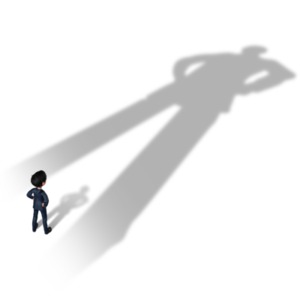 An image of a man overshadowed by a large shadow.