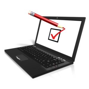 An image of a laptop with a pencil checking the box with a mark.