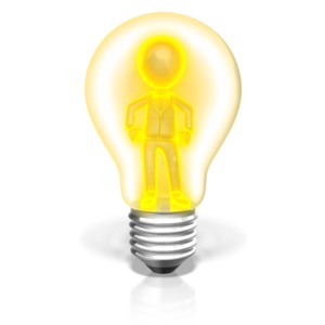 A glowing businessman stands inside a light bulb. This clip-art can represent a business person having a new idea.