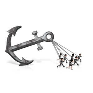 An image of a group of business people pulling a very large anchor.