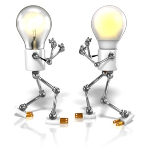A tungsten and LED light-bulb figure raise their dukes to fight each other.