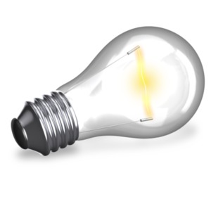 A light bulb glows yellow on it&#039;s side.