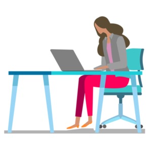 An image of woman at a desk working on her computer.