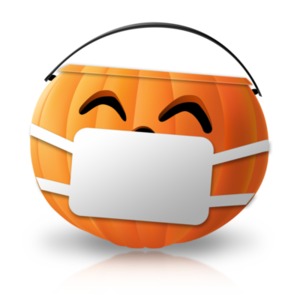 A Halloween candy pail wears a protective mask in this COVID19 during Halloween concept.