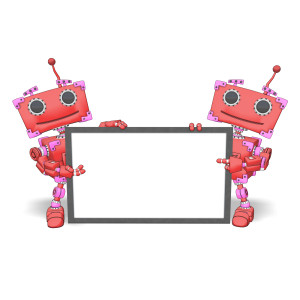 In this clipart image, two boxy robots are holding up a blank sign.  One robot is pointing inwards towards the sign, while the other robot is gesturing towards the sign.  The default robot coloring makes this a great addition to your Valentine&#039;s Day presentations, or use the custom settings to change the colors to further meet your presentation needs.