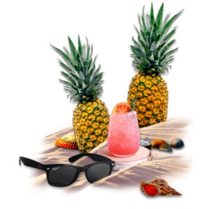 A refreshing tropical glass of fruit drink sets on the beach in this relaxing ocean scene.