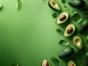 Avocados and green leaves on a vibrant green background, ideal for healthy eating presentations. 


